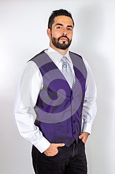 Confident handsome young bearded man in vest and shirt. Attractive stylish businessman