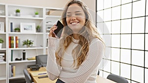Confident and happy young hispanic woman, a successful business worker, enjoying the conversation on her smartphone while standing