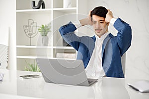 Confident Hispanic businessman in suit