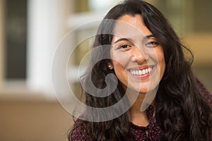 Confident Hispanic woman laughing and smiling stock photo