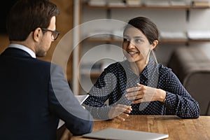 Confident Indian woman talk with employer at interview