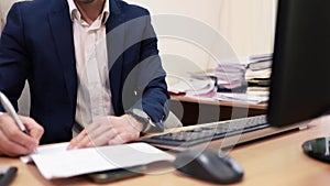 Confident investor signing business papers with pen sitting in office close up.