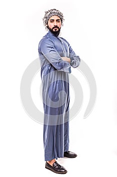 Confident khaleeji man smiling standing hands on waist wearing shemagh and thobe, isolated on white background photo