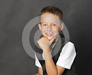 Confident kid in suit vest and shirt