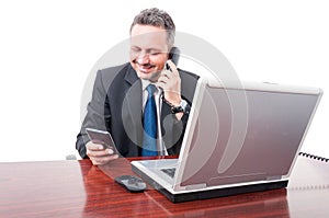 Confident lawyer talking on desk telephone