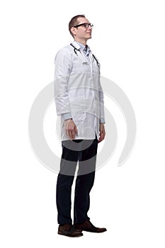 Confident male doctor pointing at you. isolated on a white