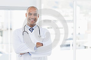 Confident male doctor smiling at camera