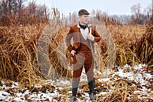 confident male hunter on the hunting field heading for the hunt. in autumn season