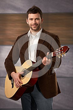 Confident man with guitar