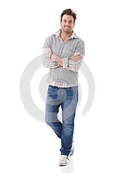 Confident man in jeans smiling