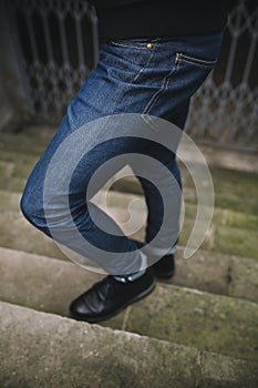 Confident man posing in selvedge jeans