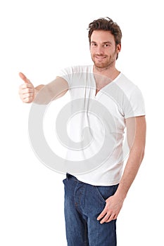 Confident man showing thumb up smiling