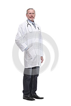 Confident mature doctor with arms crossed looking away