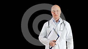 Confident mature doctor holding clipboard