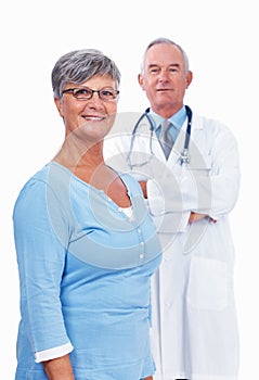 Confident mature doctor with woman. Portrait of smiling mature woman standing with confident doctor.