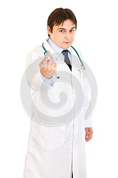 Confident medical doctor ordering to come