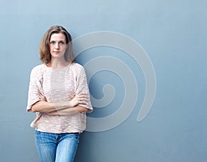 Confident mid adult woman posing with arms crossed