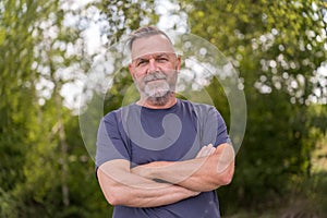 Confident middle aged man standing outdoors