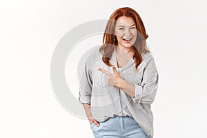 Confident middle-aged redhead european woman telling about interesting product recommend check-out promo smiling toothy