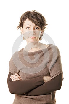 Confident middle aged woman in brown sweater