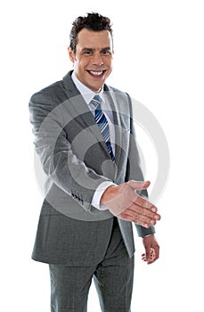 Confident modern businessman offering handshake