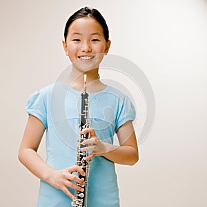 Confident musician holding clarinet