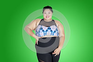 Confident obese woman wearing sportswear
