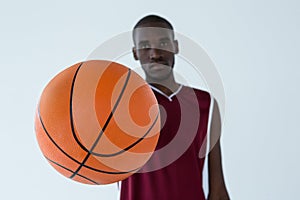 Confident player holding basketball