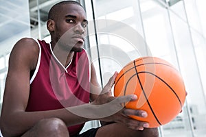 Confident player holding basketball