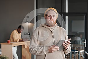 Confident portly guy in office