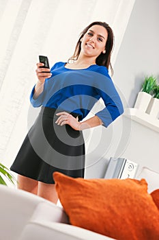 Confident pose with smartphone in hand