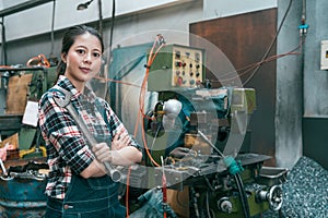 Confident professional lathe factory worker woman