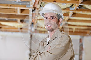 Confident professional male builder with arms crossed