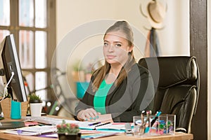 Confident Professional Woman in a Creative Office