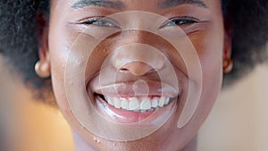 Confident and proud black woman smiling, showing strength and dignity. Closeup of the face and head of a beautiful young