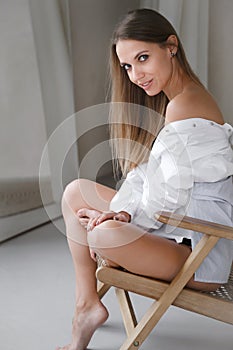 Confident relaxed free woman in sunny morning room