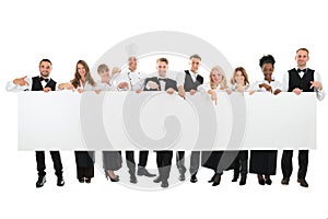 Confident Restaurant Staff Holding Blank Billboard