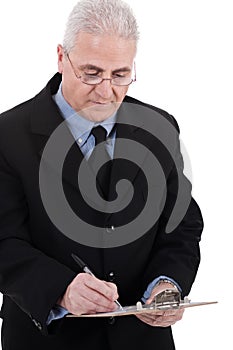 Confident senior business man writing on