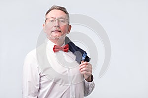 Confident senior businessman in blue suit. Studio shoot