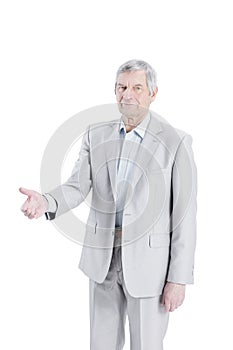 Confident senior businessman holding out hand for a handshake