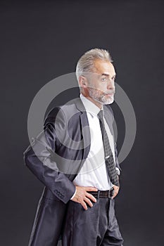 Confident senior businessman.isolated on dark background