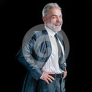 Confident senior businessman. isolated on dark background