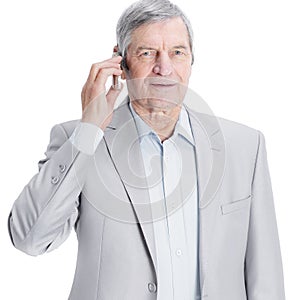 Confident senior businessman with mobile phone. isolated on a white background