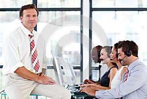 Confident senior manager in a call center