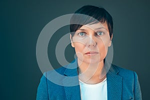 Confident serious business woman portrait with copy space