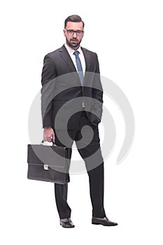 confident serious businessman with a leather briefcase. isolated on white