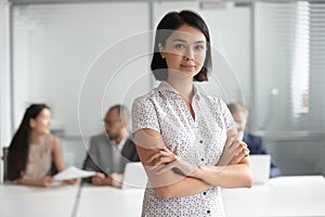 Confident serious pleasant korean female executive manager portrait.