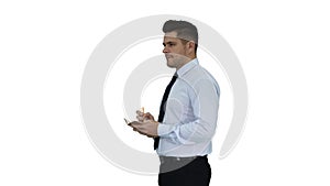 Confident serious smart businessman having an idea and making notes on white background.