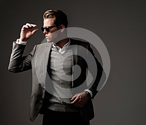 Confident sharp dressed man in grey jacket.