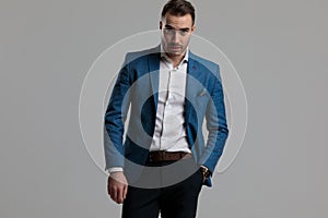 Confident smartcasual model holding hand in pocket